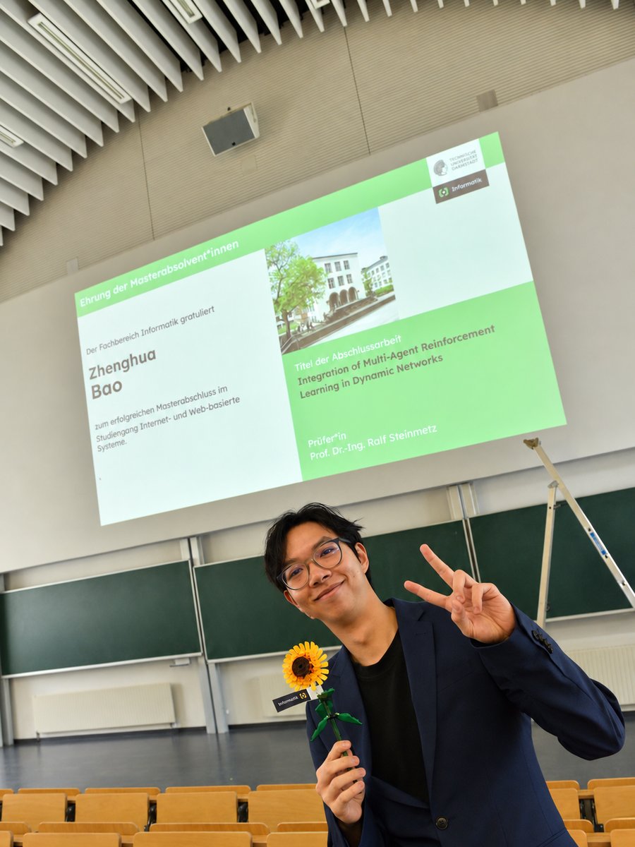 Zhenghua Bao at his master's graduation at TU Darmstadt, in front of a slide naming his thesis